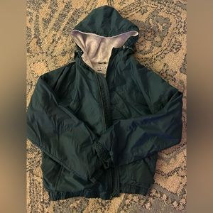 green rain jacket